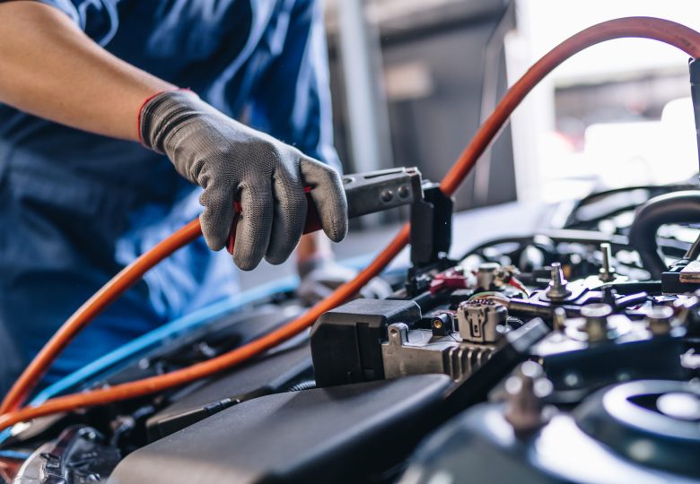 Maintenance worker in garage shop service to customer car via insurance system at garage, Safety vehicle to reduce accidents before a long travel, road trip transportation.